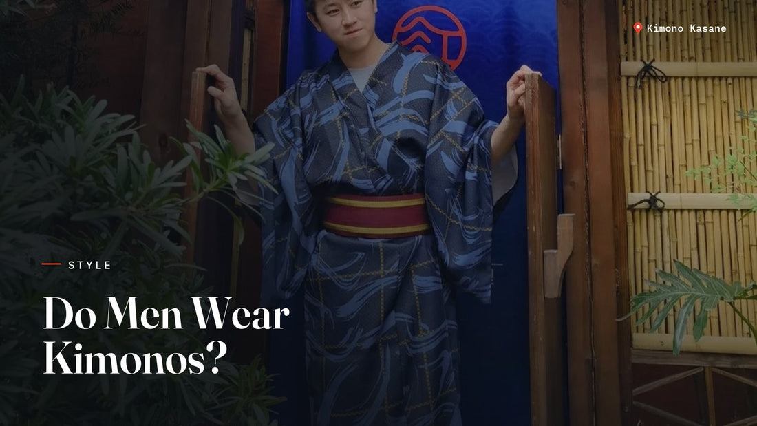 Man wearing a blue men's kimono (yukata) with a red obi belt standing in a traditional Japanese doorway